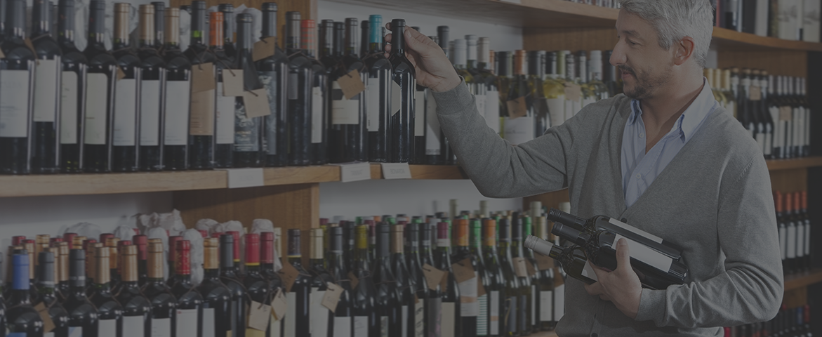 man shopping in wine store