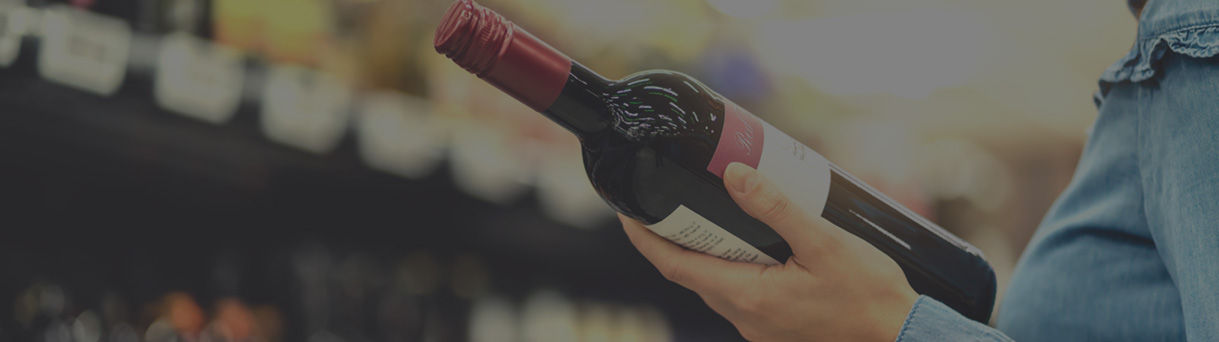 man holding bottle of wine