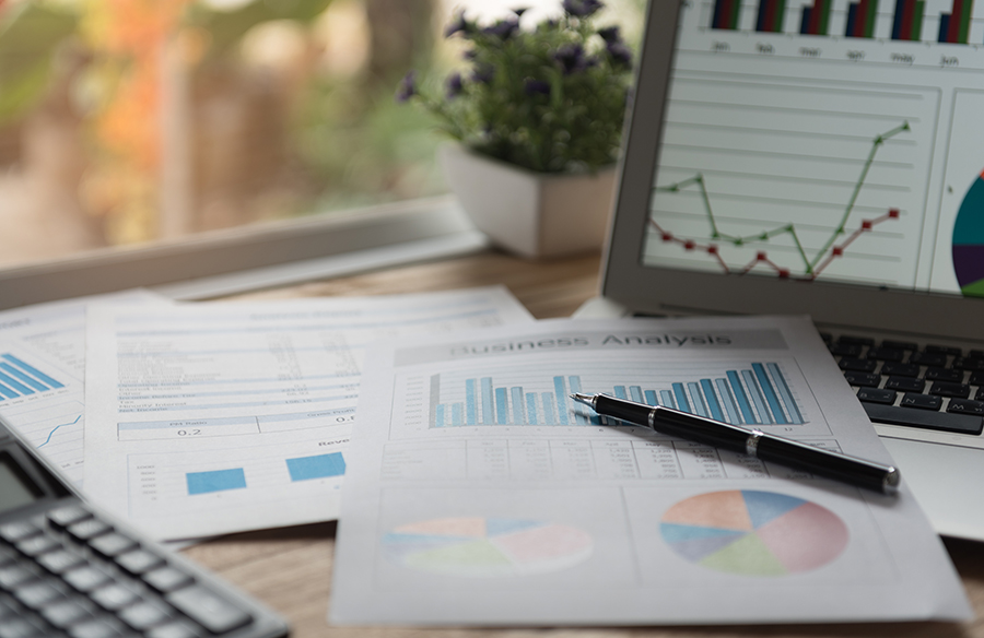 financial concept. business earning report and financial chart and graph report on desk.